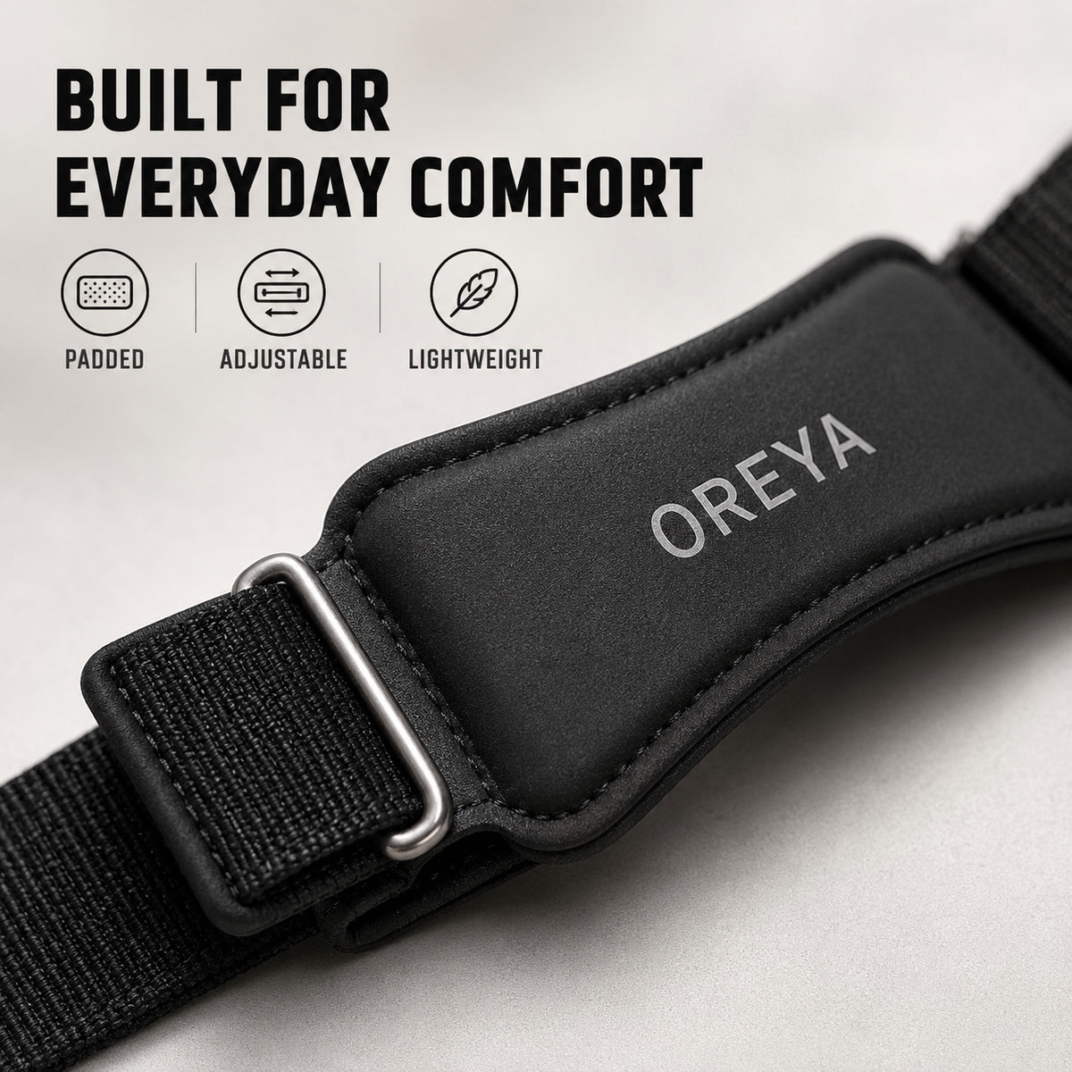 Close-up of OREYA Precision Knee Support Strap materials and adjustable design